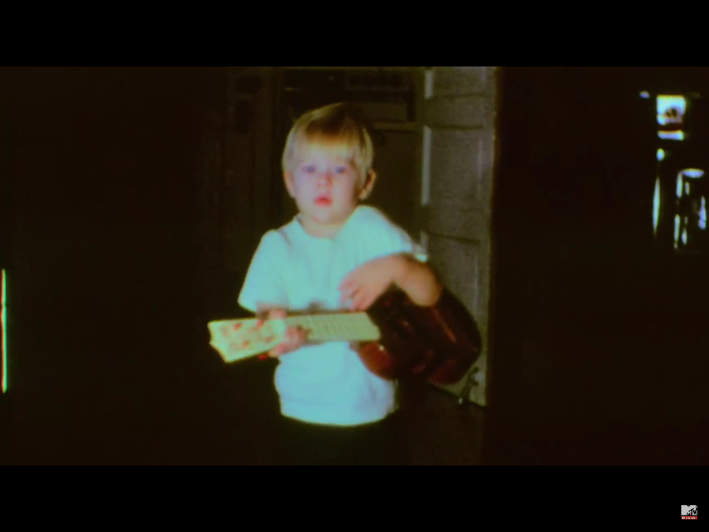 Kurt Cobain playing ukulele as a Child